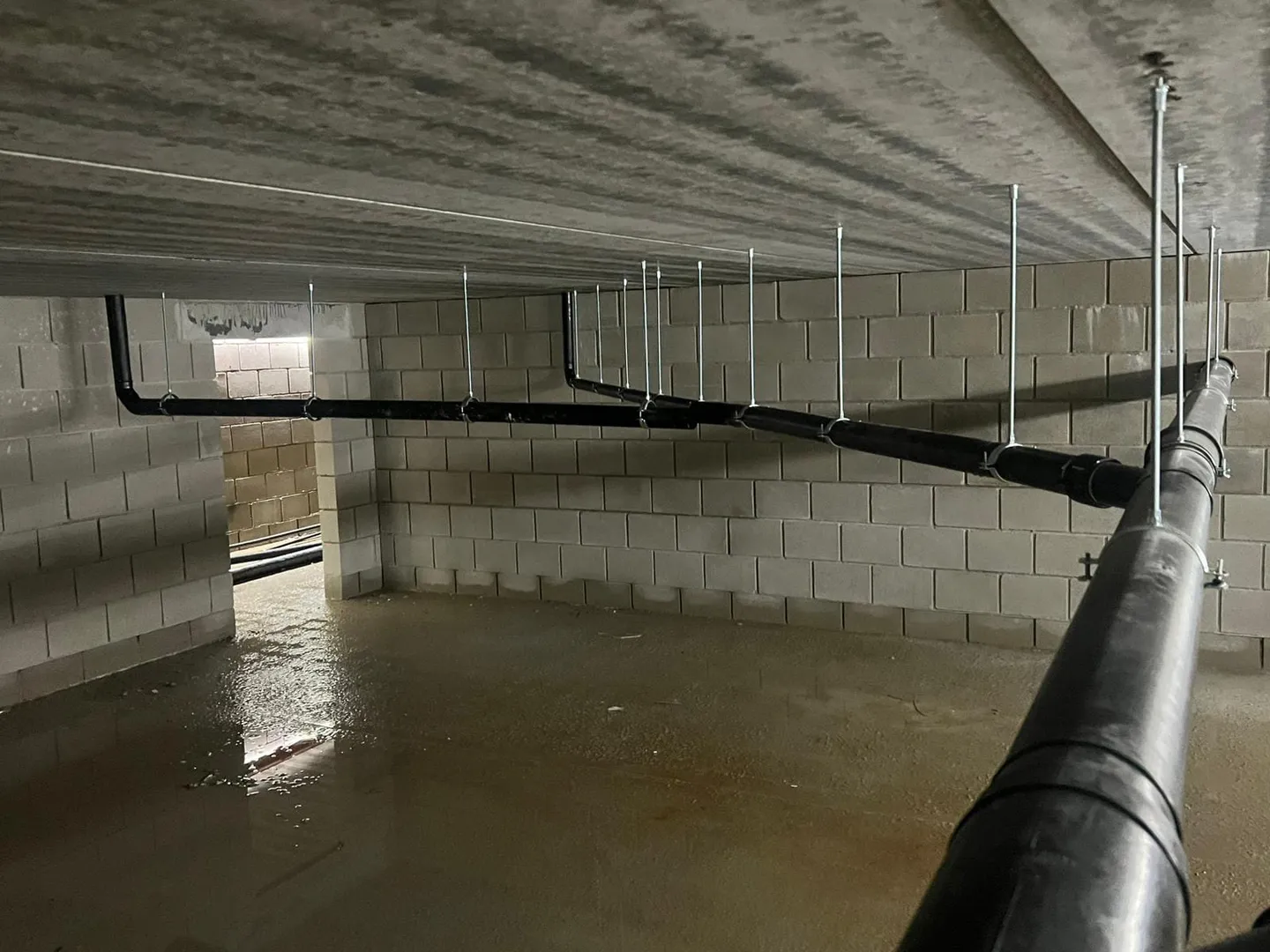 Basement pipework installation with mounted pipe supports